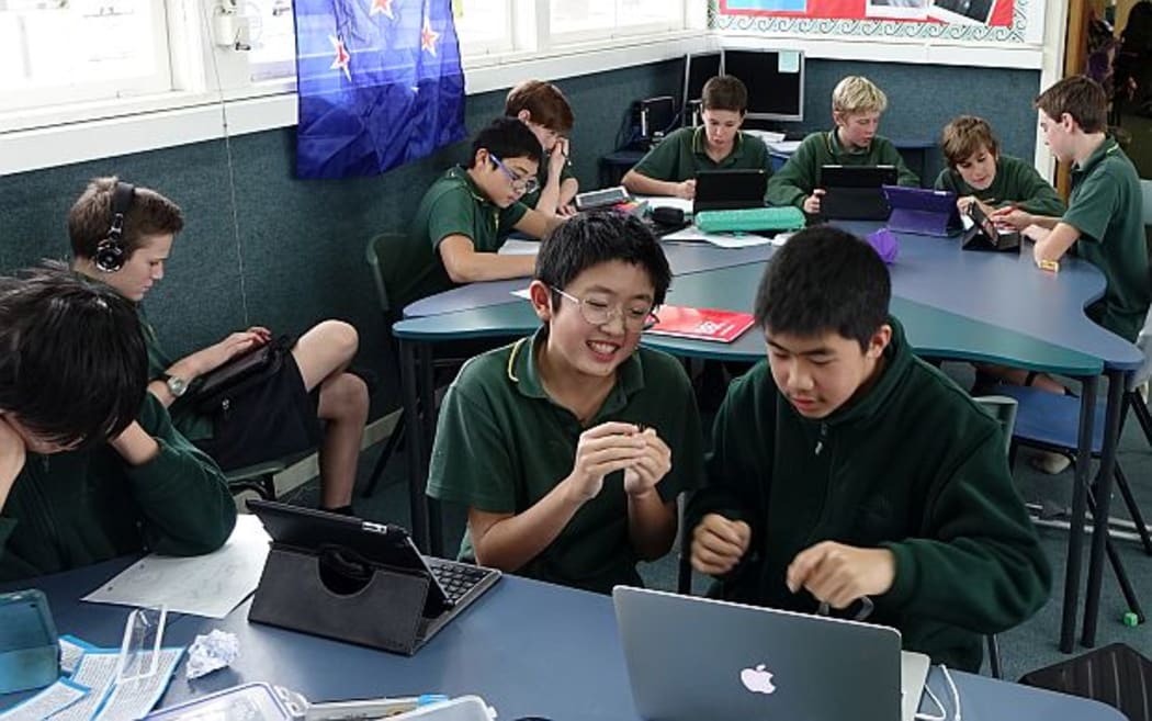 Intermediate school children in class