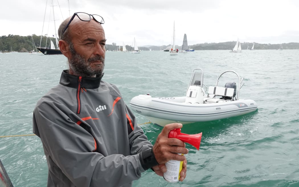 Race official Bruno Bomati signals the start.
