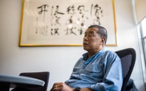 (FILES) In this file photo taken on June 16, 2020, millionaire media tycoon Jimmy Lai, 72, speaks during an interview with AFP at the Next Digital offices in Hong Kong.