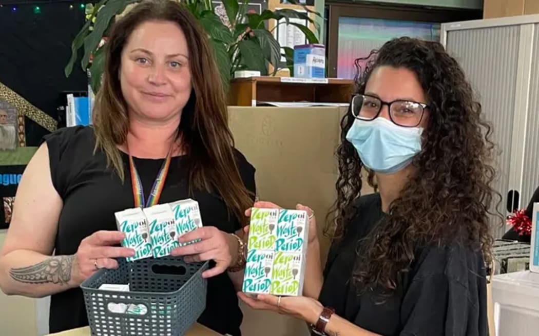 Kōkiri Marae Sexual & Reproductive Health Promoter/Educator Shelley Duffin (left) holdin period care products.