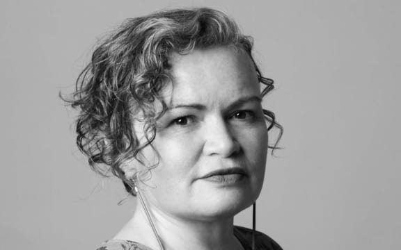 Tina Makereti faces the camera in a black and white portrait