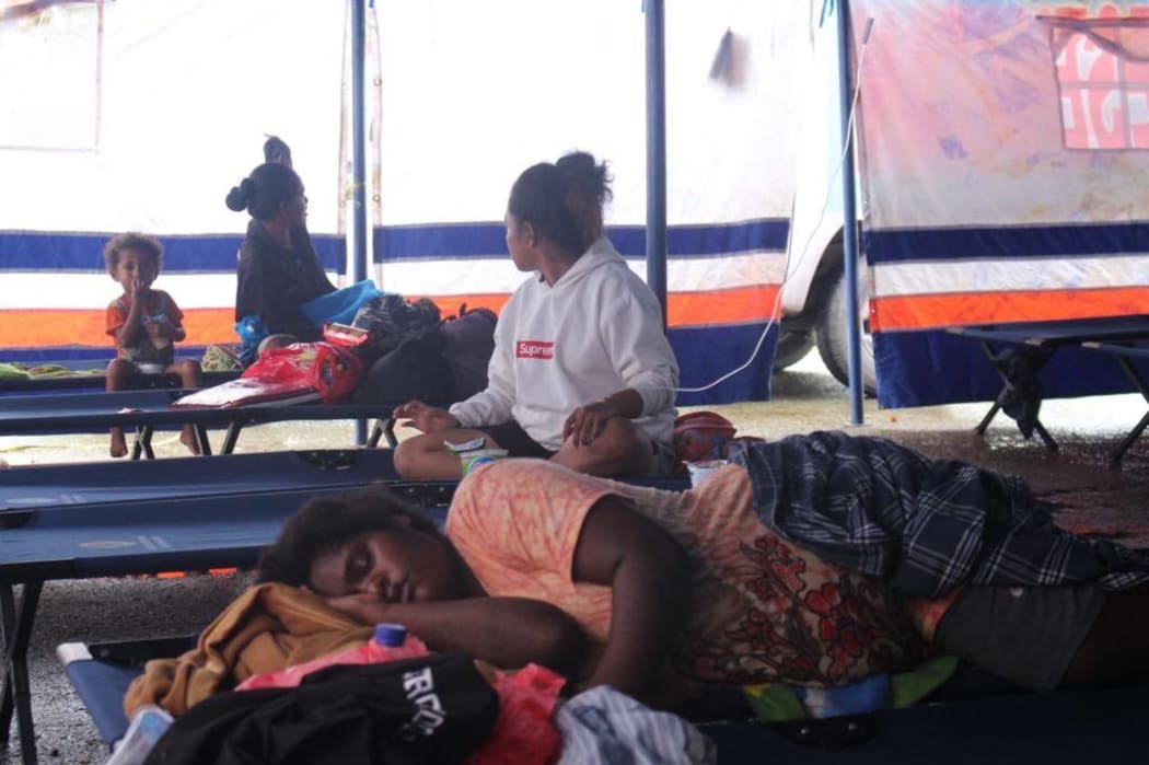 People recovering following the flooding in Jayapura.