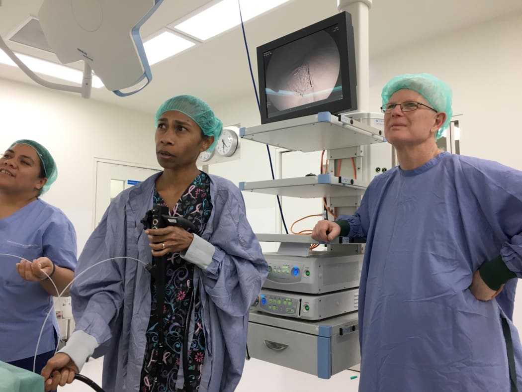 Dr. Sereana Ledua Natuman, Head of Medical Unit department, Vila Central hospital is being mentored through a skill in gastroscopy by Dr Ian Turner, ANZGITA volunteer, gastroenterologist from Sydney.