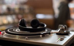 Turntable in record shop.