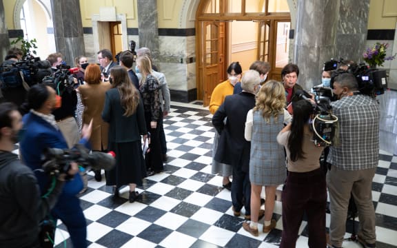 Government ministers field questions from journalists during the 'bridge run' on the tiles at Parliament.