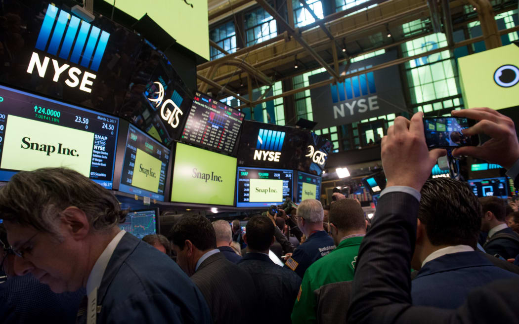 Traders at the New York Stock during the Snap Inc. float.
