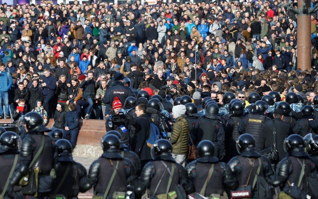 Russian riot police detain protesters during an opposition rally on March 26, 2017 in Moscow.