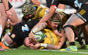 Hurricanes TJ Perenara scores a try.