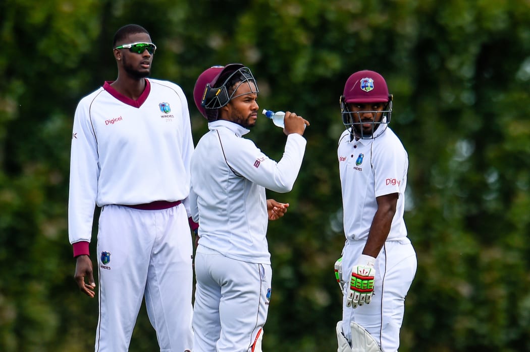 West Indies players Jason Holder with Shai Hop  and Sunil Ambris during Day 1 of the warm-up Cricket match against New Zealand on Saturday.