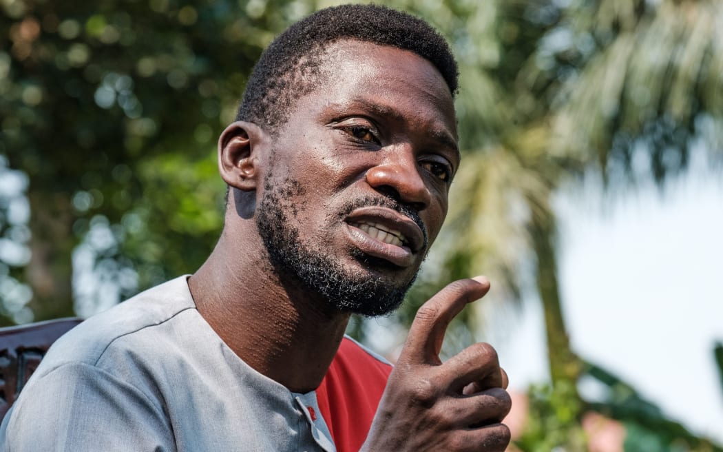 Musician turned politician Robert Kyagulanyi, aka Bobi Wine, addresses the media at his home in Wakiso, Uganda, on January 8, 2021 to announce his plans to take President Yoweri Museveni to the International Court Commission (ICC),