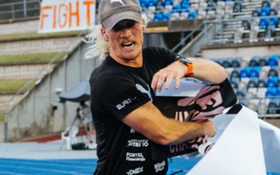 Nedd Brockmann crossing the finish line after his 1000-mile charity run in Sydney.