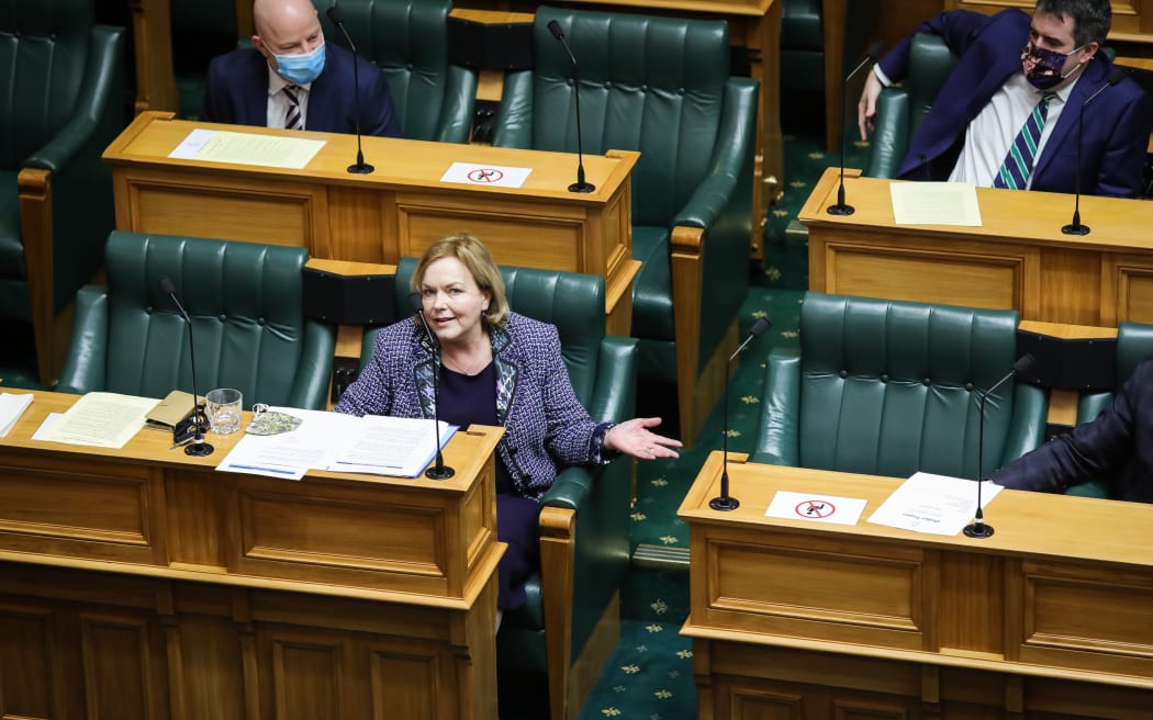 Judith Collins watched by colleagues
