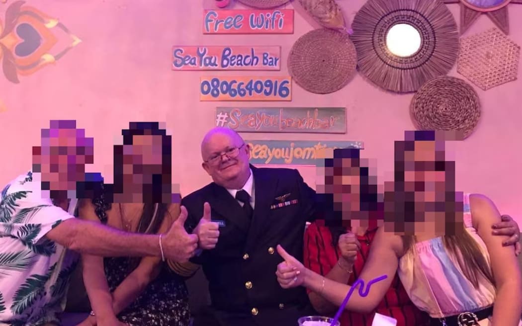 Mr Cowell dressed in his admiral uniform at a bar in Thailand.  (Supplied)