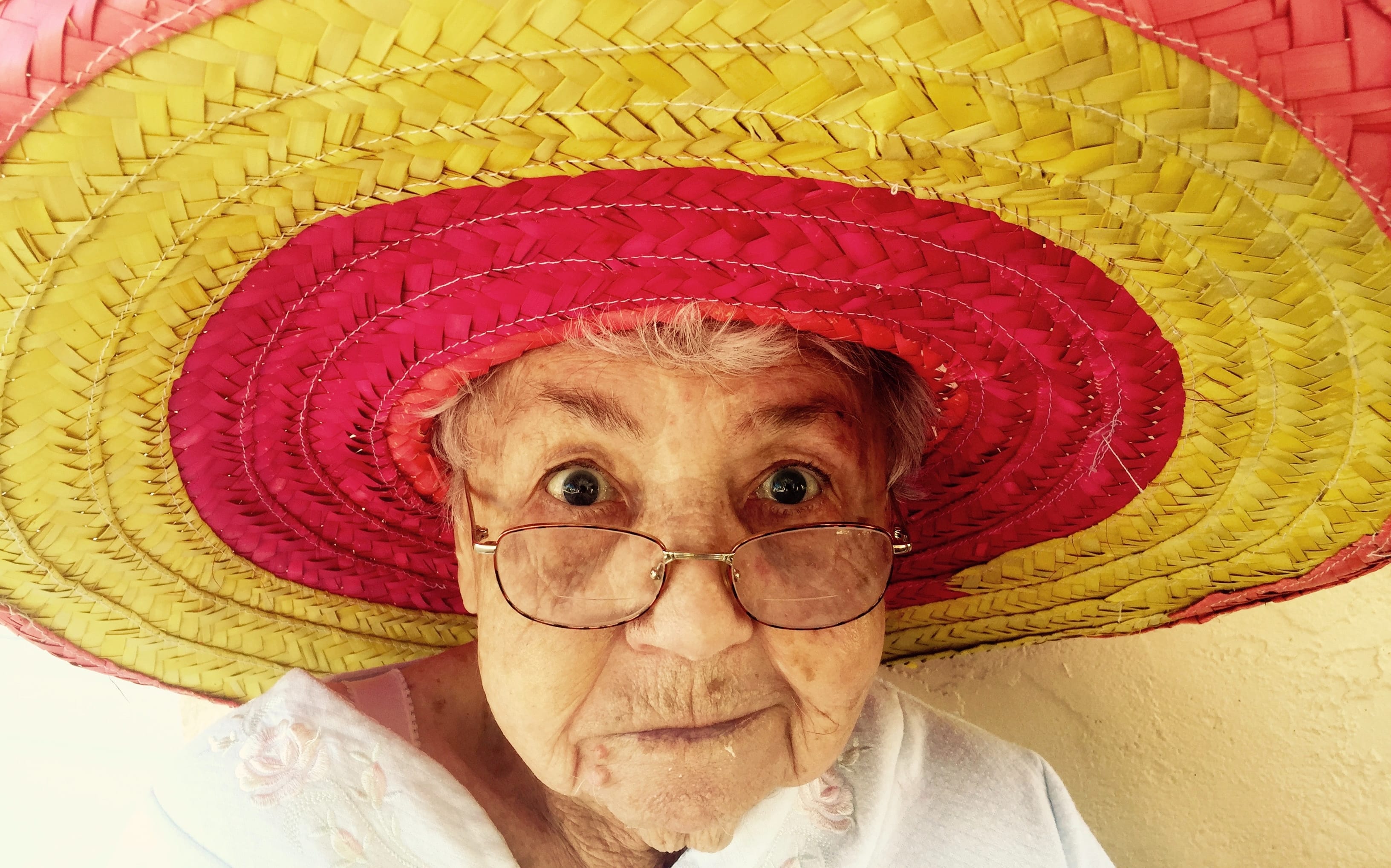 elderly woman in colourful hat