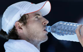 Andy Murray takes a drink in intense heat during a match in Melbourne.