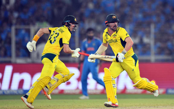 Australia's Marnus Labuschagne (L) and Travis Head (R) cross over for a run during the 2023 ICC Cricket World Cup final against India.