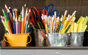 Pens and pencils in a classroom.