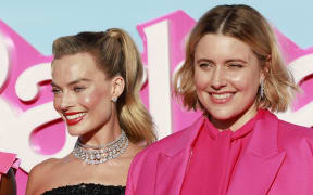 US actress Issa Rae (L), Australian actress Margot Robbie (C) and director Greta Gerwig (R) arrive for the world premiere of "Barbie" at the Shrine Auditorium in Los Angeles, on July 9, 2023. (Photo by Michael Tran / AFP)