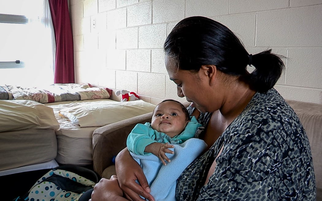 Nicole and her youngest child, who are paying $190 per night in emergency housing at a motel