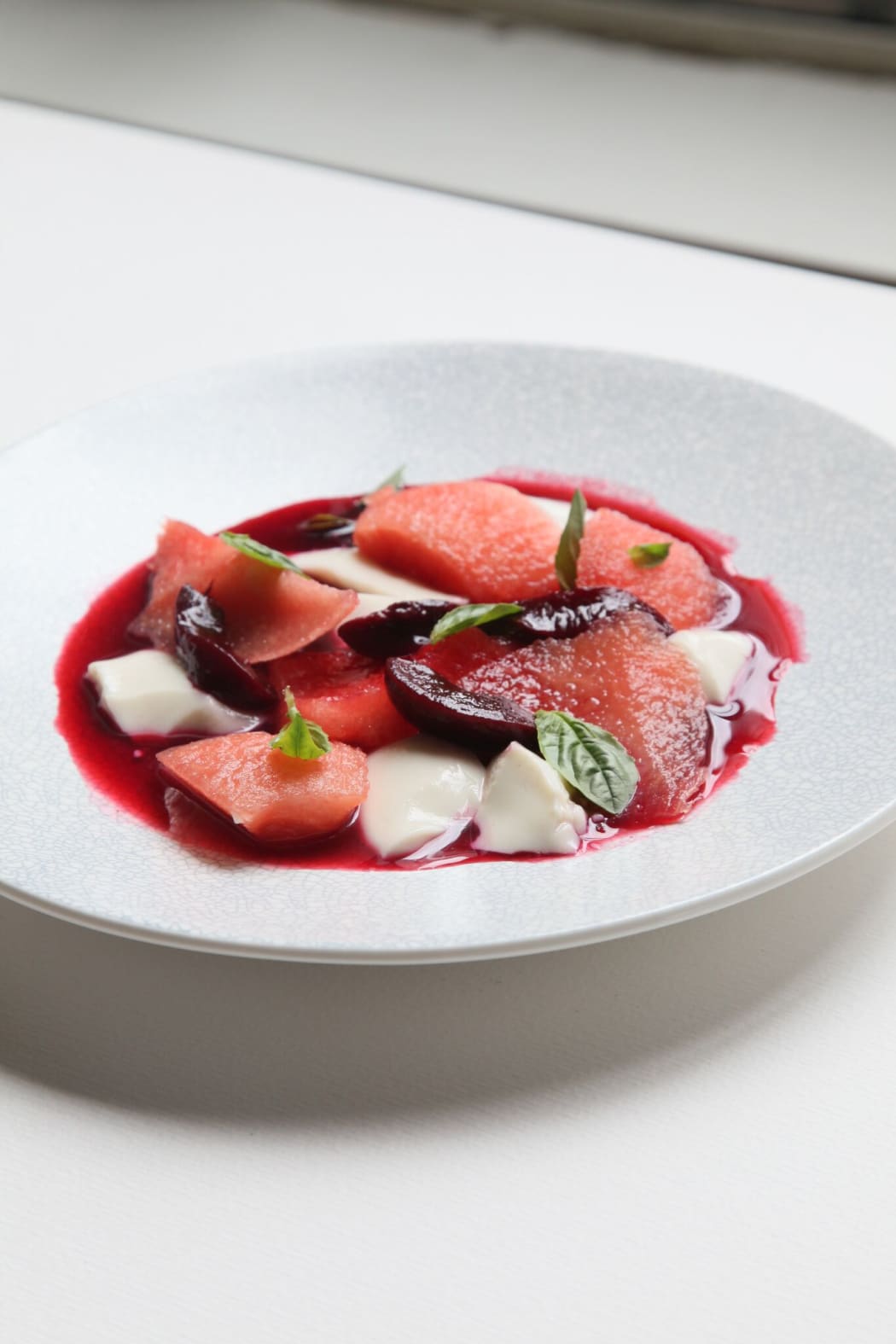 Plums, basil, almond milk jelly, and watermelon
