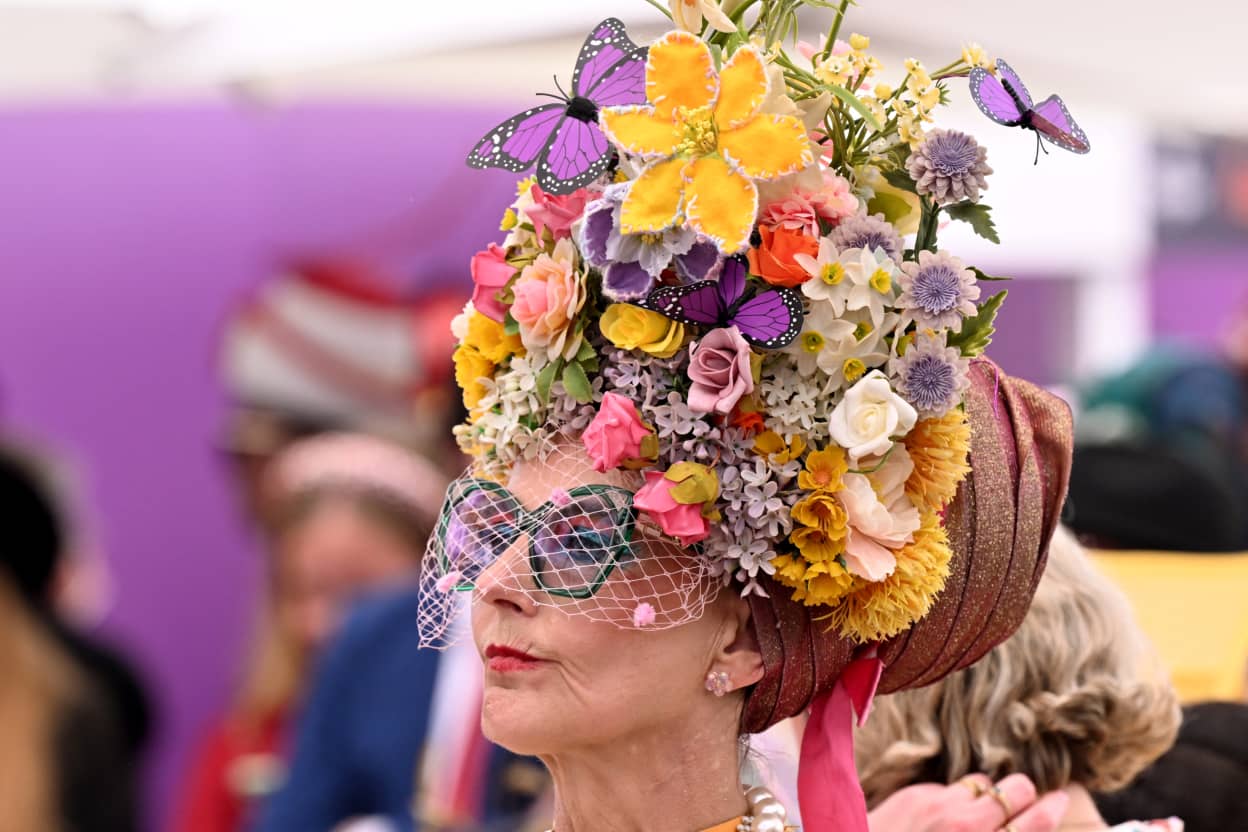 People watch the Fashion in the Field competition before the running of the Melbourne Cup horse race at the Flemington Racecourse in Melbourne on November 4, 2025.