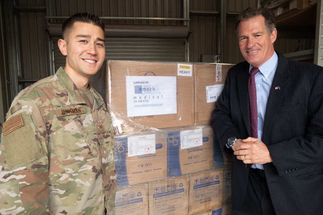 Ambassador Scott Brown (right) with Technical Sergeant Curtis Hoofman, U.S. Air Force