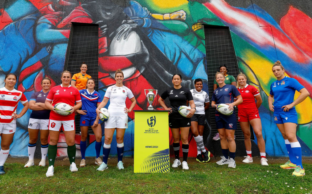 (L-R) Rachel Malcolm (Scotland), Saki Minami (Japan), Siwan Lillicrap (Wales), Shannon Perry (Australia), Gaelle Hermet (France), Sarah Hunter (England), Kennedy Simon (New Zealand), Sereima Leweniqila (Fiji), Kate Zackary (USA), Nolusindiso Booi (South Africa), Sophie de Goede (Canada) and Elisa Giordano (Italy) pose in front of a mural specially created for the tournament during the Rugby World Cup 2021 Captains' Photocall at Eden Park on 2 October, 2022 in Auckland, New Zealand. (Photo by Hagen Hopkins - World Rugby/World Rugby via Getty Images)