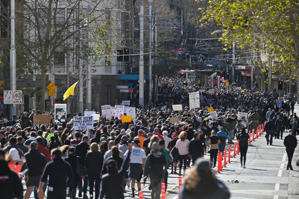 Thousands of anti-lockdown protestors march on the streets of the central business district of Sydney on July 24, 2021, as people gathered to demonstrate against the city's month-long stay-at-home orders.