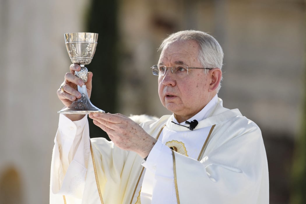 Conservative Archbishop of Los Angeles Jose H Gomez prepares Holy Communion.
