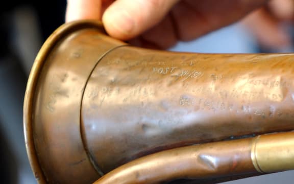 Kevin Hickman holding the bugle.