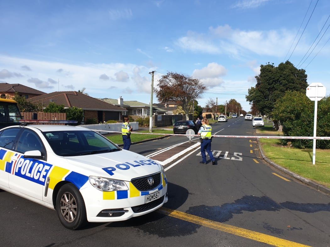 Police at Central Avenue in Papatoetoe after a man wielding a machete was shot dead.