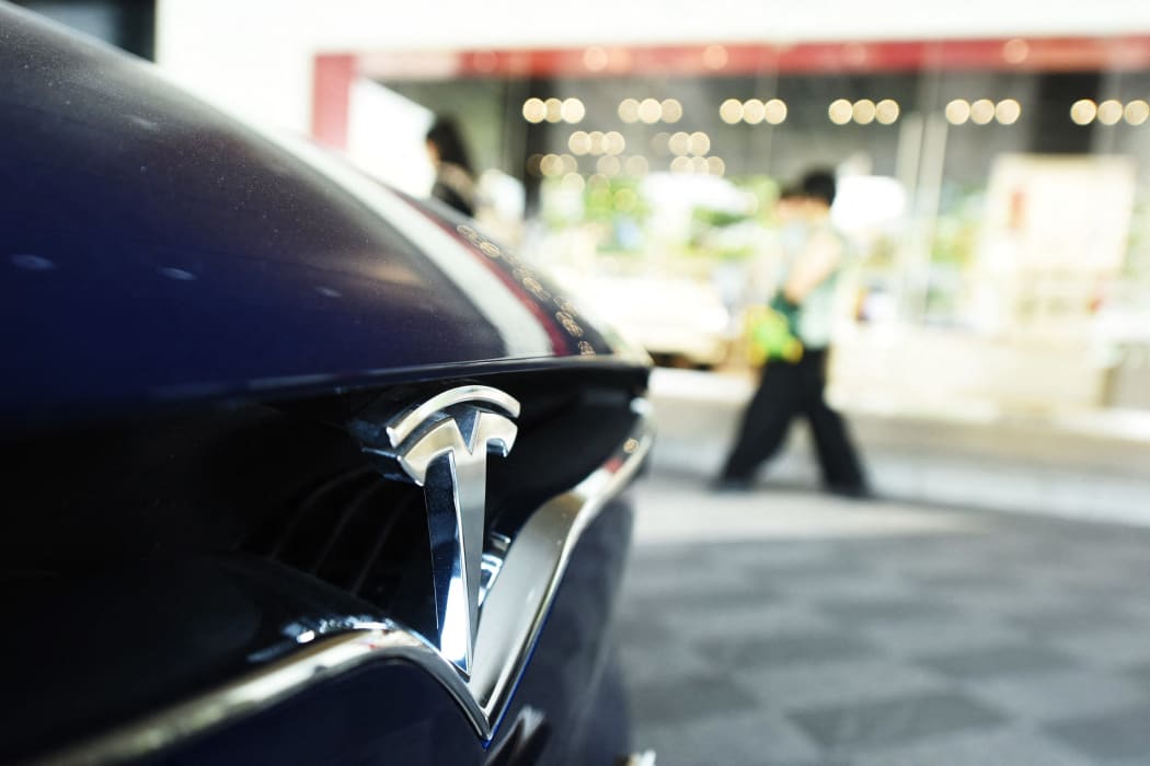 A Tesla Model S car is for sale at a dealership in Hangzhou city, east China's Zhejiang province, 19 June 2018.