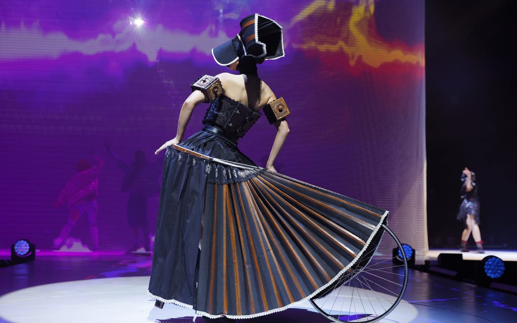 Wanton Widow by Kate MacKenzie of New Zealand is modelled in the Open Section during the 2022 World of WearableArt Preview Show at TSB Bank Arena