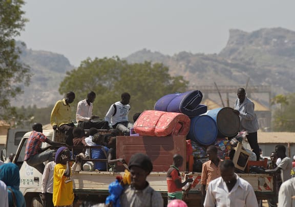 Residents leave the capital Juba as tensions remain high.