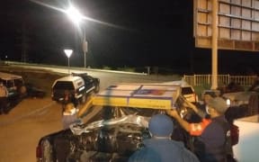 PNG police loading cartons of seized cocaine.