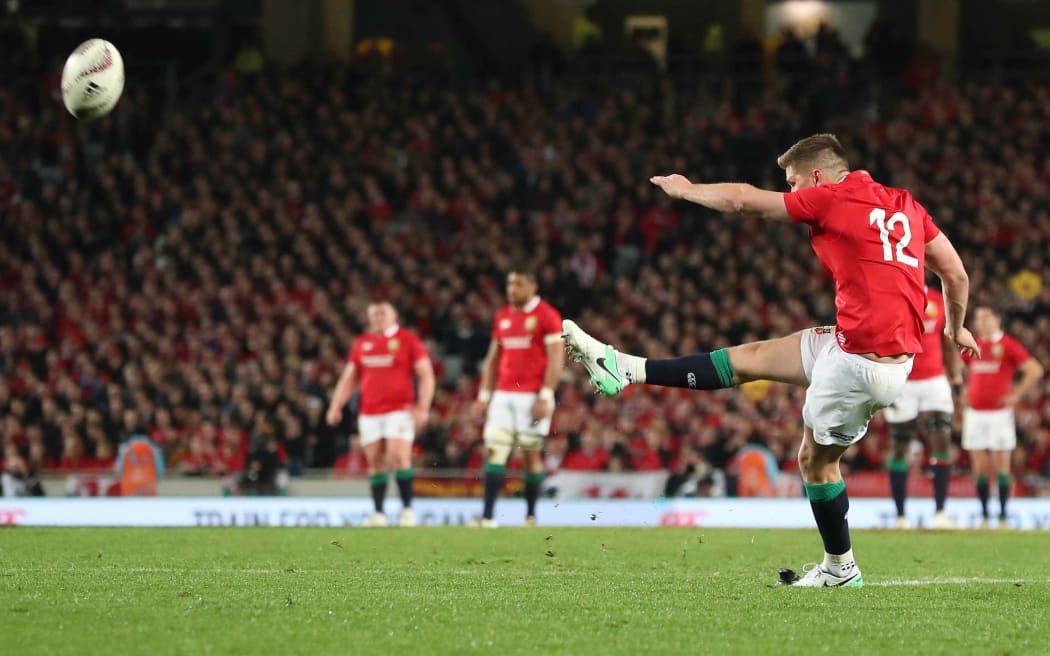 Owen Farrell kicks a penalty for the Lions.