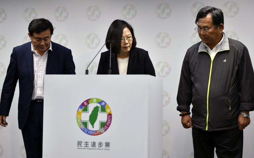 Taiwan President Tsai Ing-wen (C) speaks during a press conference at the headquarter of ruling Democratic Progressive Party (DPP) in Taipei