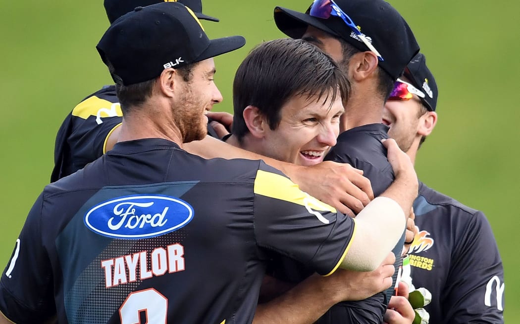 Wellington players mob Hamish Bennett after their victory