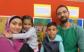 Kutaiba Alakkad with his wife Gianhn Alarioishi and their children.