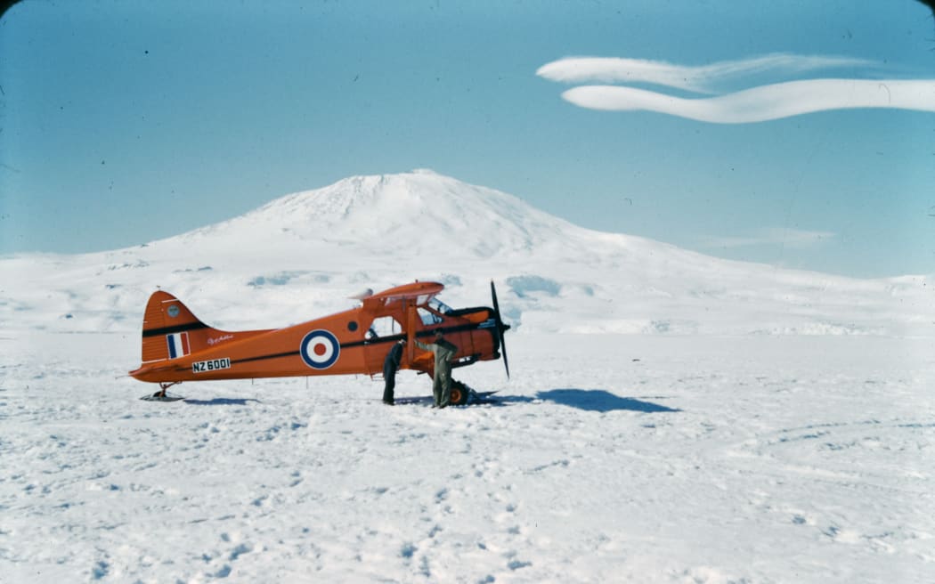 Image from the Laurence Walter Tarr personal collection.
Side view of RNZAF Antarctic Flight Beaver NZ6001 on the sea ice in McMurdo Sound, with Mt. Erebus in the background. Antarctica.