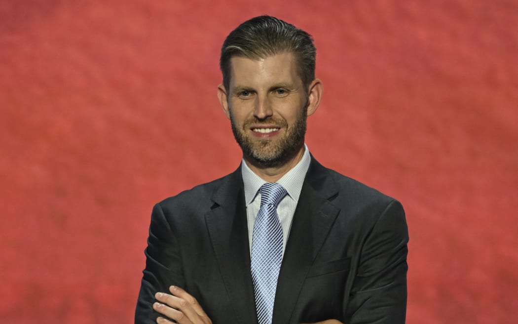 Son of Former US President Donald Trump, Eric Trump pose on stage during the third day of the 2024 Republican National Convention at the Fiserv Forum in Milwaukee, Wisconsin, on July 17, 2024. Days after he survived an assassination attempt Donald Trump won formal nomination as the Republican presidential candidate and picked Ohio US Senator J.D. Vance for running mate. (Photo by ANDREW CABALLERO-REYNOLDS / AFP)