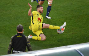Phoenix's Tim Payne makes a pass during the A-League.