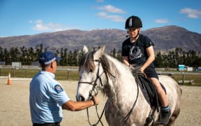 Constable Paddy Henderson puts kids through their paces during the Grab the Reins programme in Central Otago