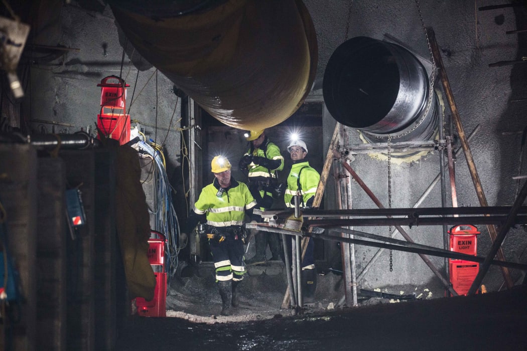 Geotechnical engineer Chris Lee, Mine Deputy Kirk Neilson and Chief Operating Officer Dinghy Pattinson opening the doors to the mine.