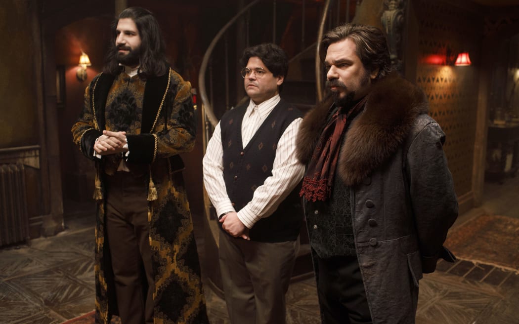 Kayvan Novak as Nandor, Harvey Guillen as Guillermo and Matt Berry as Laszlo in What We Do In The Shadows