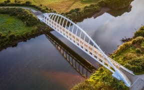 Te Rewa Rewa bridge is a tourist drawcard but the Waiwhakaiho River it spans is usually unsafe for swimming.