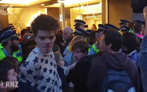 Protesters block entrance to Minerals Forum in Dunedin