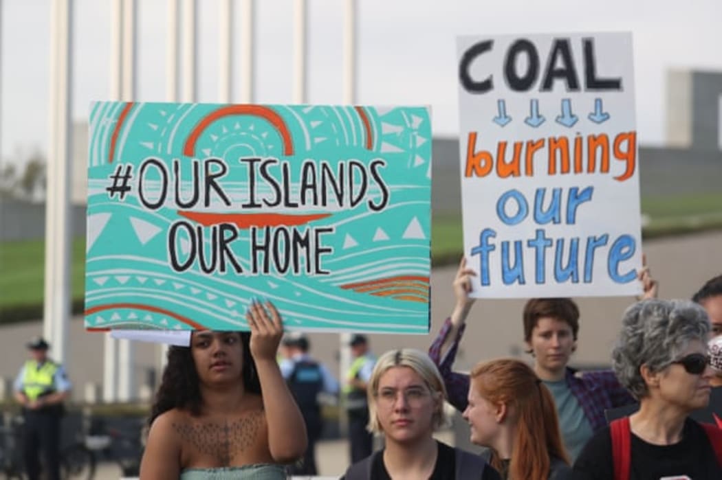 Pacific climate activists outside the Australian parliament