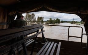 NZ Army Unimog travels through flooded roads near Puketapu, west of Napier, February 16.