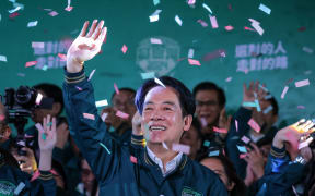 TAIPEI, TAIWAN - JANUARY 13: Confetti flies over the stage and crowd as Taiwan's Vice President and presidential-elect from the Democratic Progressive Party (DPP) Lai Ching-te speaks to supporters at a rally at the party's headquarters on January 13, 2024 in Taipei, Taiwan. Taiwan voted in a general election on Jan. 13 that will have direct implications for cross-strait relations. (Photo by Annabelle Chih/Getty Images)